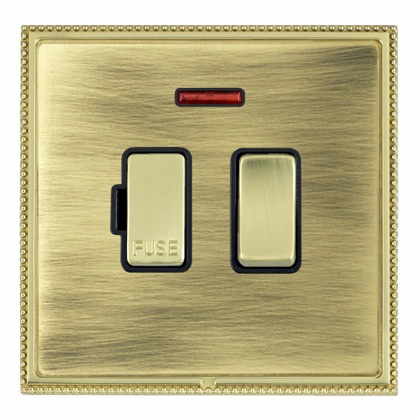 Linea-Perlina CFX Polished Brass Frame/Antique Brass Front 1 gang 13A Double Pole Fused Spur and Neon Polished Brass/Black